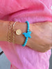 TURQUOISE BEADS BRACELET WITH BIRD CAHRM